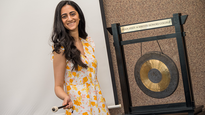 Khushi Patel rings the gong at Penn State Harrisburg