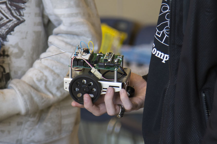 student holding robot