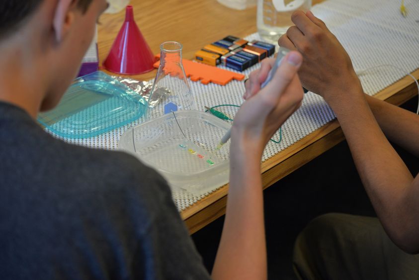 two students working on science project