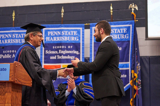 Student receiving award