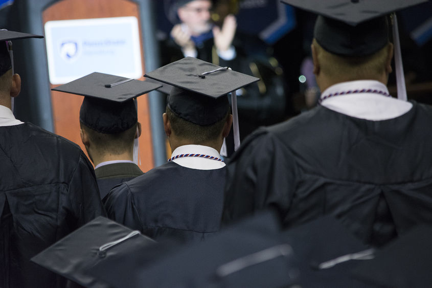 students in caps and gowns