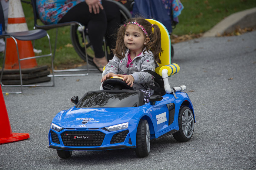 child testing toy car