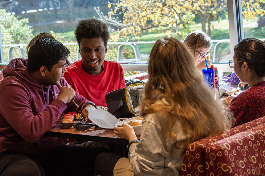 Peer mentors and Career studies students gather for lunch.