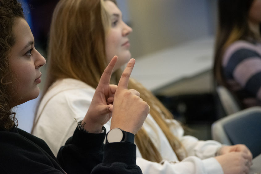 Students practice sign language in class