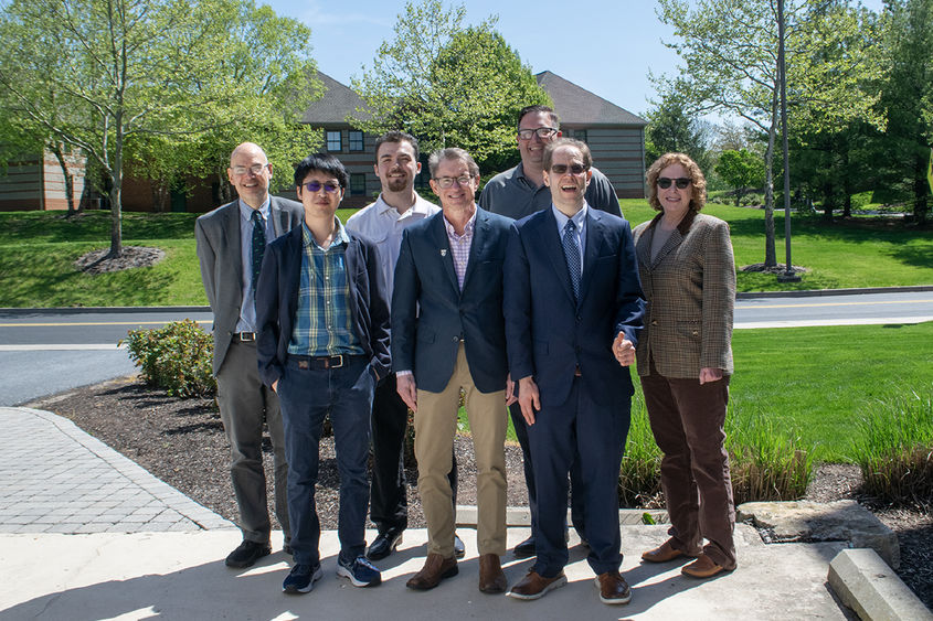 Group photo of Daniel Boustead with Penn State Harrisburg faculty members and recipients of the scholarship Boustead established