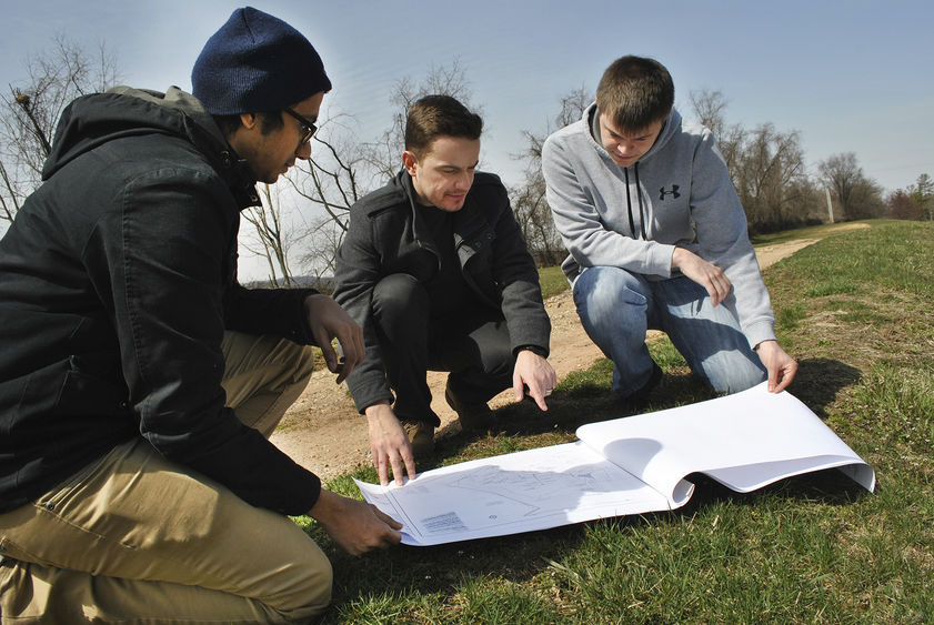 students studying storm water system