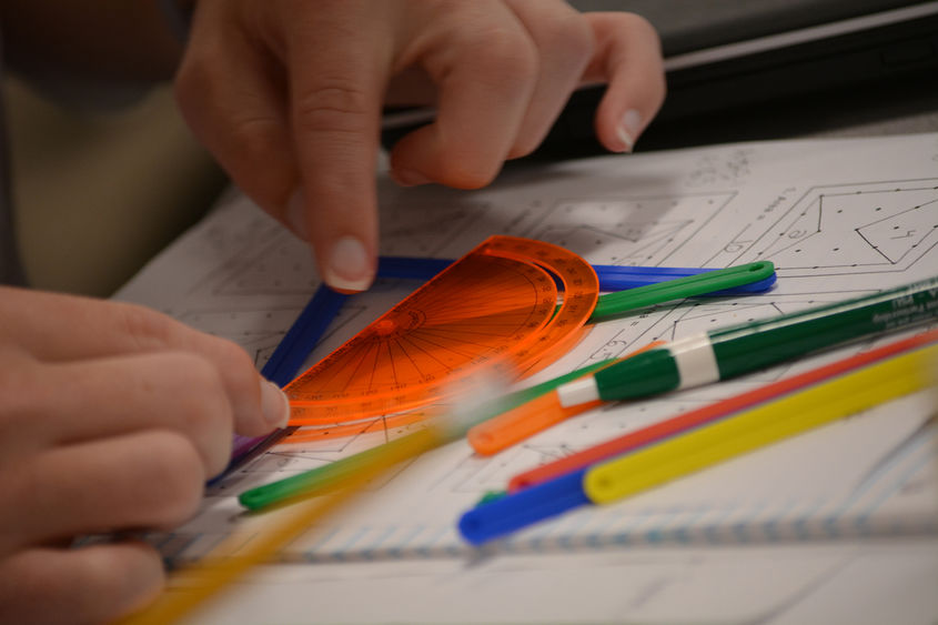 hands working with protractor