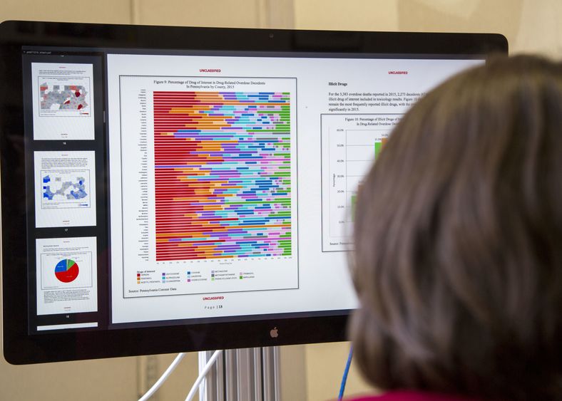 A woman reviews statistics related to drug overdoses in Pennsylvania