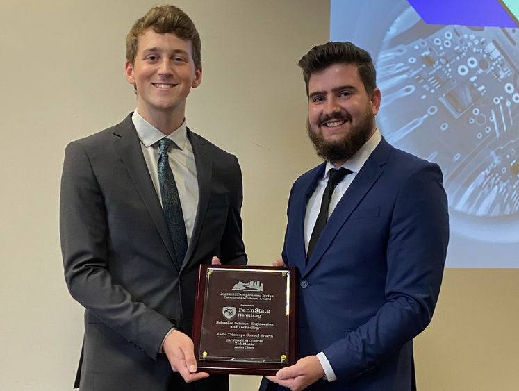 Photo of Aaron Olsen and Zachary Martin holding award from the Institute of Electrical and Electronic Engineers (IEEE) Susquehanna Section