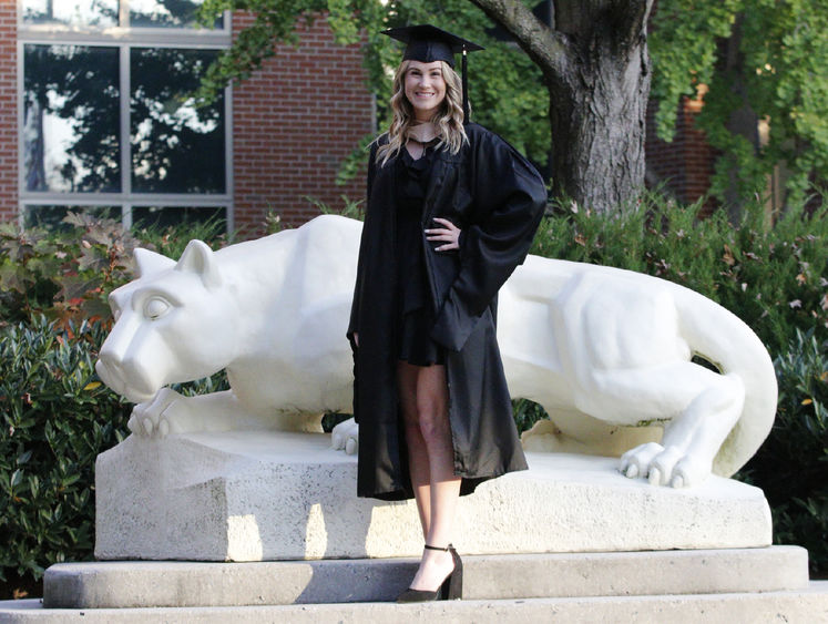 Kylee Altland in front of Lion Shrine on campus