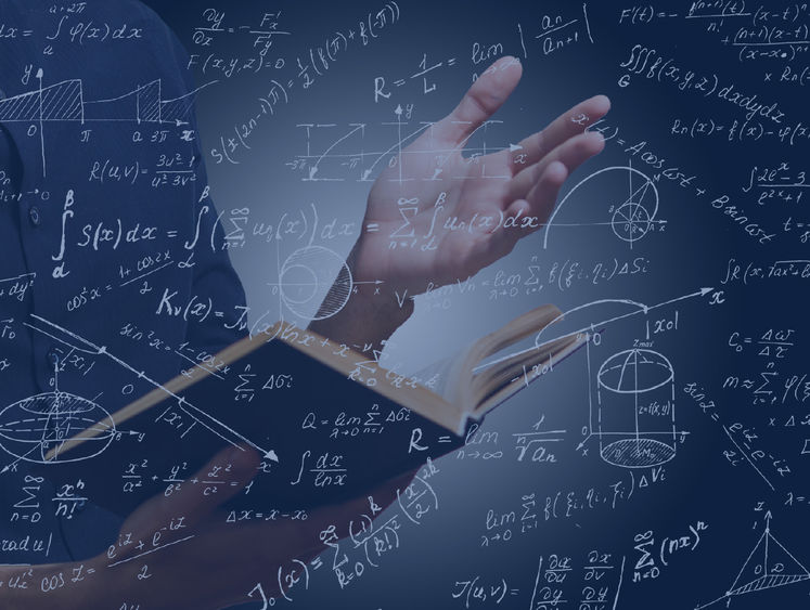 Math equations overlaying a picture of hands holding a book
