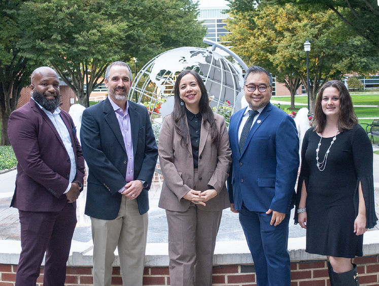 Group photo of five people on Penn State Harrisburg campus