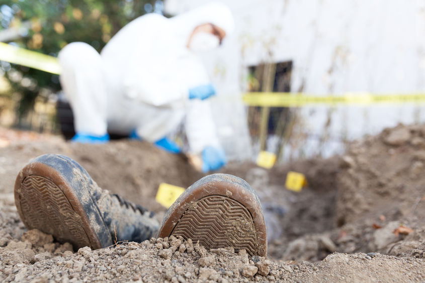 excavating victim's grave