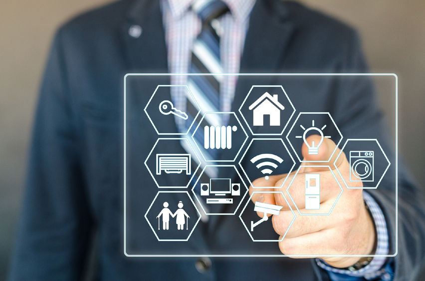 man in suit touching smart board