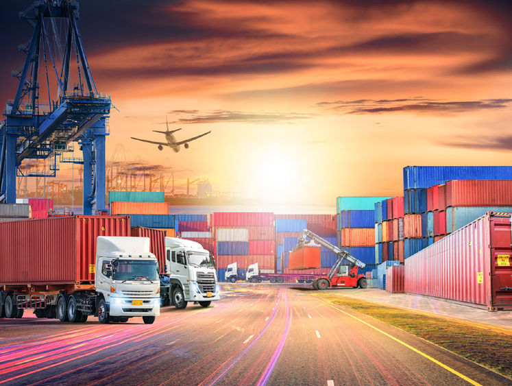 Shipping yard with airplane overhead 